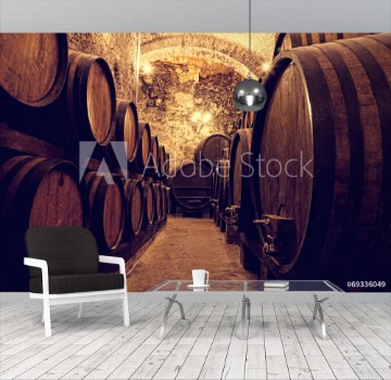 Picture of Wooden barrels with wine in a wine vault Italy